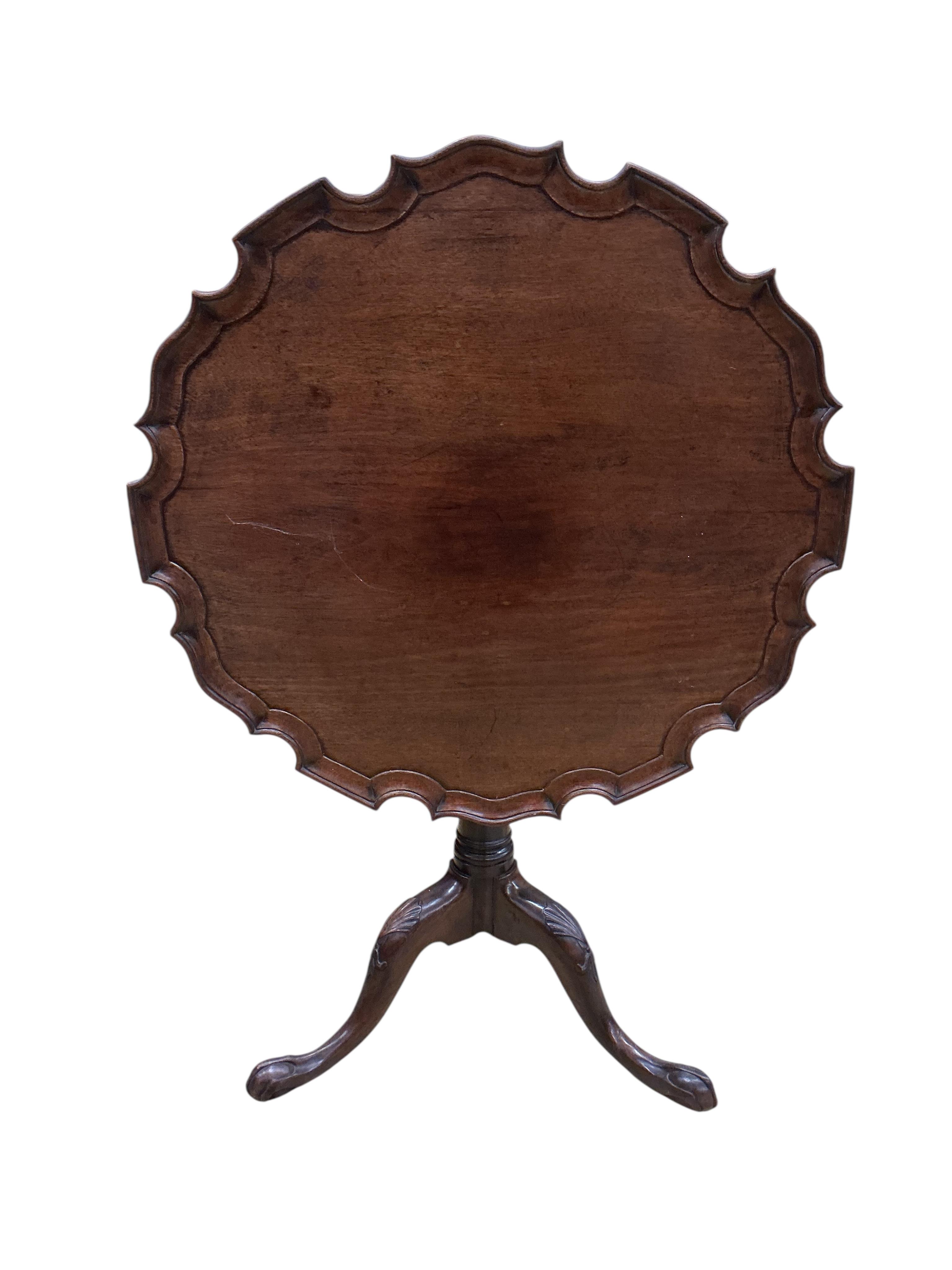 A George III piecrust circular tilt top tripod tea table, diameter 77cm, height 68cm